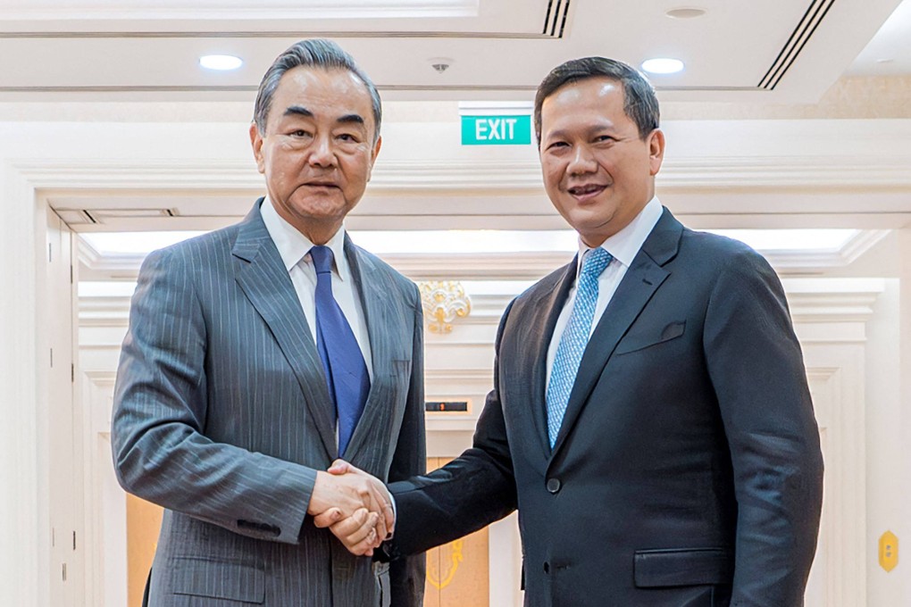 Cambodias Prime Minister Hun Manet (right) shakes hands with China’s Foreign Minister Wang Yi in Phnom Penh. Photo: AFP