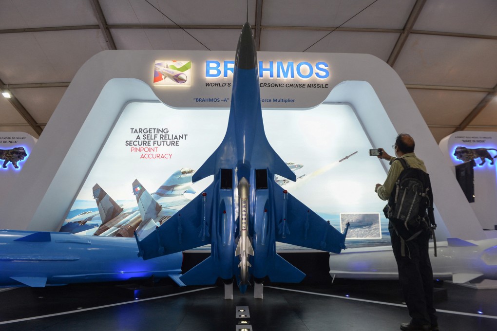 A visitor admires a BrahMos missile on display at the stall of India’s Defence Research and Development Organisation at a defence expo on the outskirts of Chennai in 2018. Photo: AFP