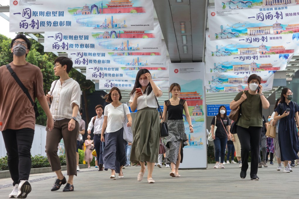 Civil servants leave government headquarters at Tamar. The new course comes after positive feedback from civil servants taking part in training courses aimed at strengthening their national identity. Photo: May Tse