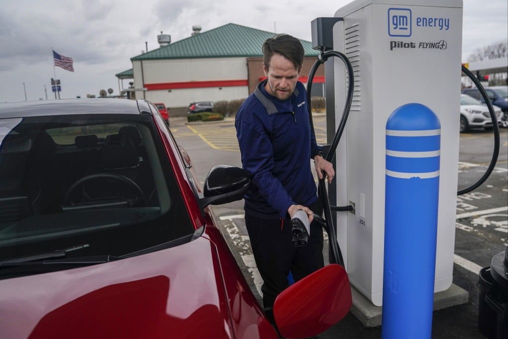 An electric car owner recharges his vehicle at a charging station in London, Ohio, the US on March 8. If EV pricing in the US can approach the level of China’s, demand will mushroom. Photo: AP