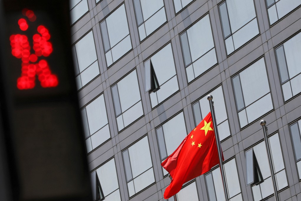 A Chinese national flag flutters outside the China Securities Regulatory Commission building on Financial Street in Beijing, on July 9, 2021. Photo: Reuters