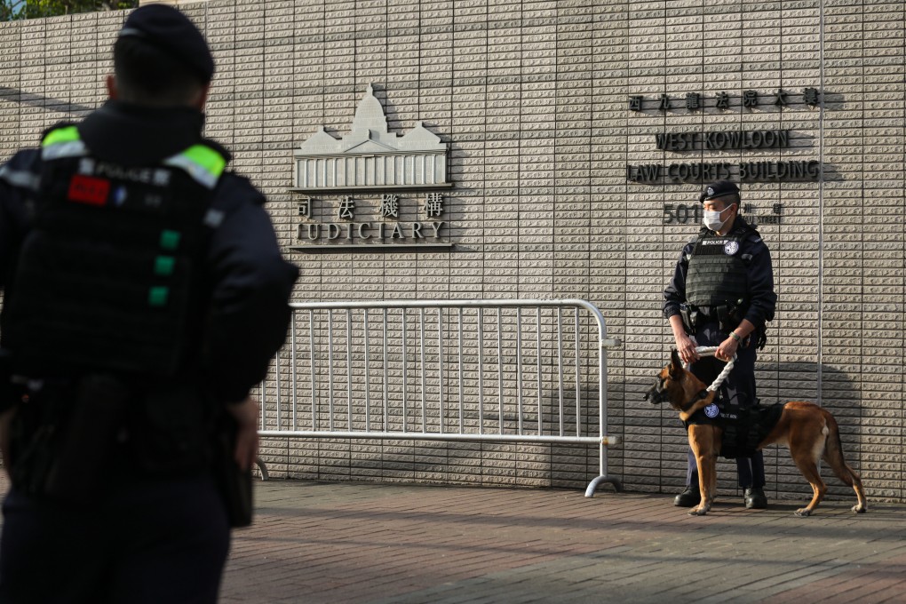 Police officers patrol outside West Kowloon Court amid Jimmy Lai’s ongoing national security trial. Photo: Xiaomei Chen