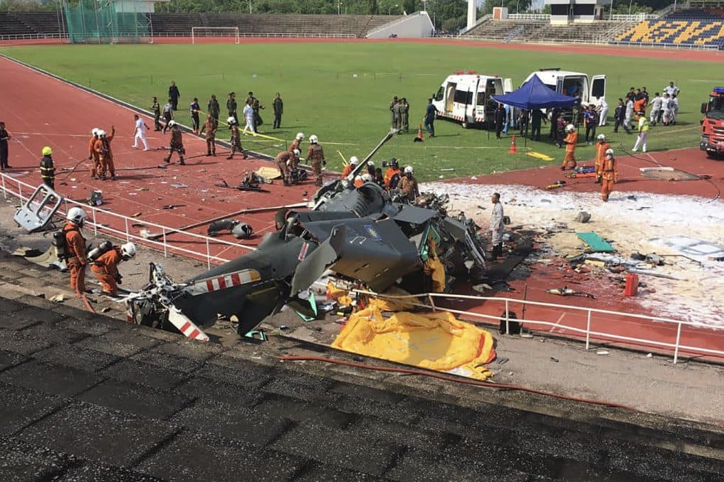 One of the two helicopters crashed into a stadium within Lumut naval base in Malaysia’s Perak state. Photo: Facebook/Fire and Rescue Department of Malaysia