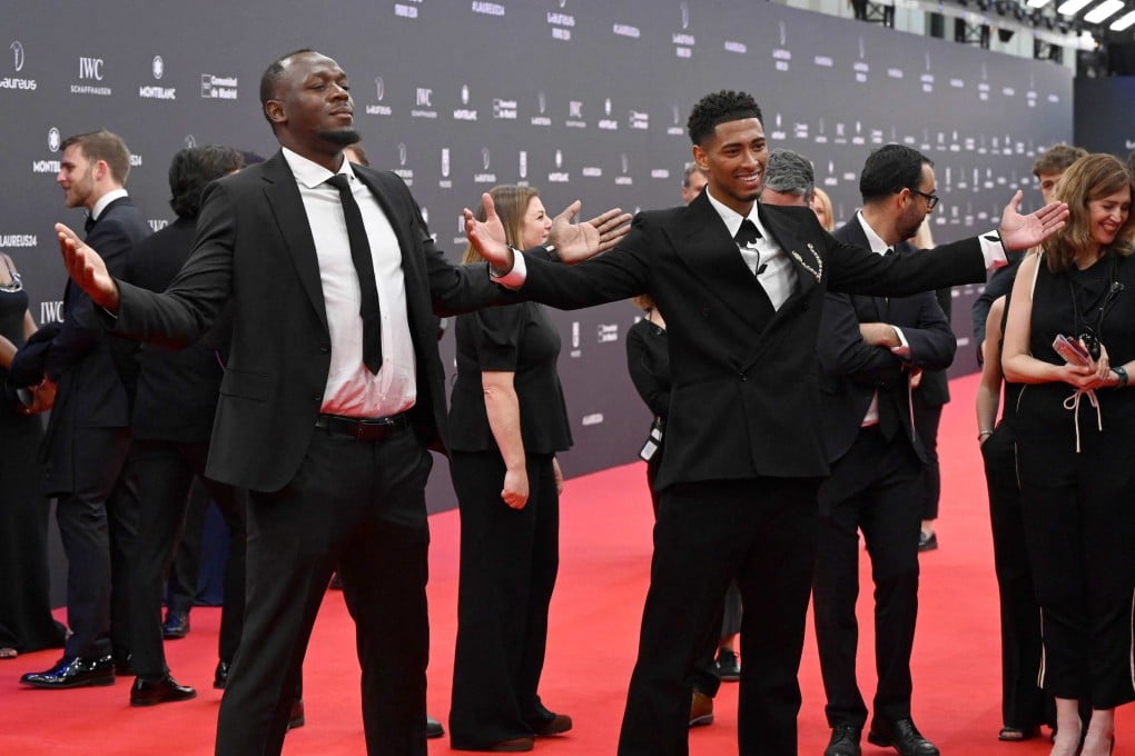 Jamaican sprint legend Usain Bolt (left) and Real Madrid’s Jude Bellingham recreate the latter’s open arms goal celebration at the Laureus World Sports Awards in Madrid on Monday. Photo: AFP