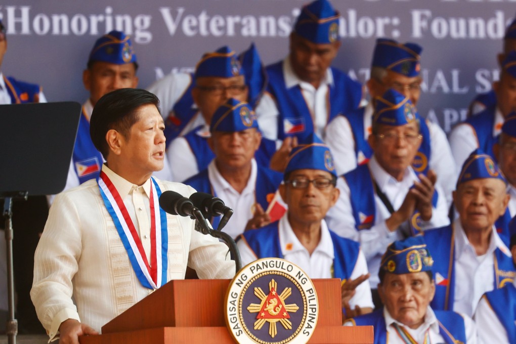 Philippine President Ferdinand Marcos Jnr speaks next to Filipino veterans in Bataan province earlier this month. Photo: EPA-EFE