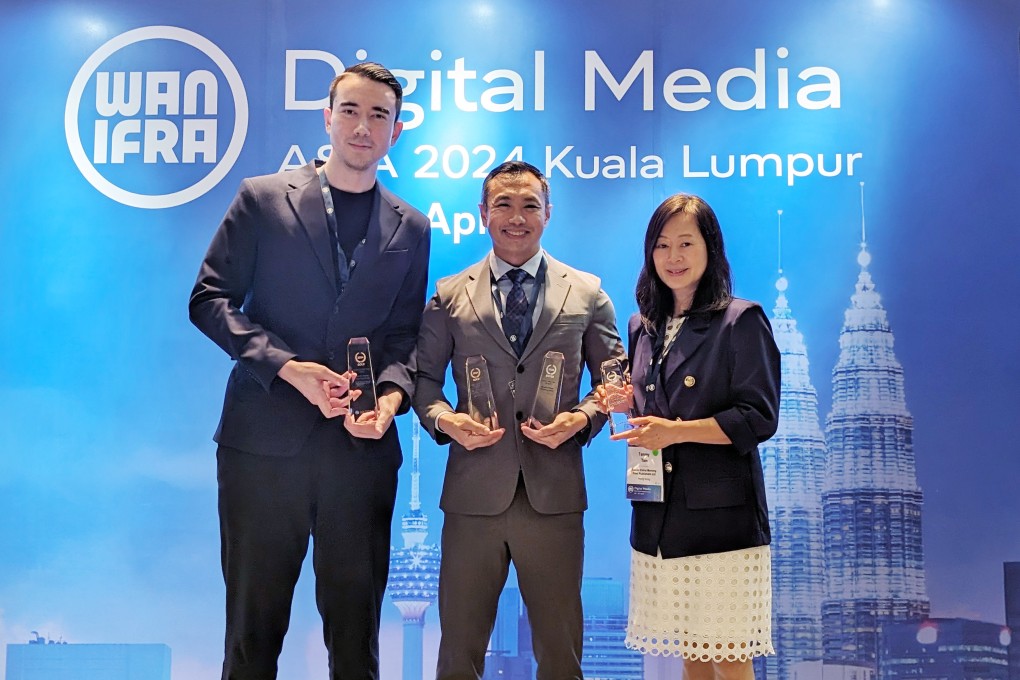 Post digital editor Shea Driscoll (left), director of video Chieu Luu and editor-in-chief Tammy Tam pick up the prizes at the WAN-IFRA awards in Malaysia. Photo: Handout