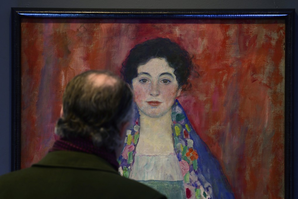 A man looks at the “Portrait of Fraulein Lieser” by Austrian painter Gustav Klimt in Vienna. Photo: AP