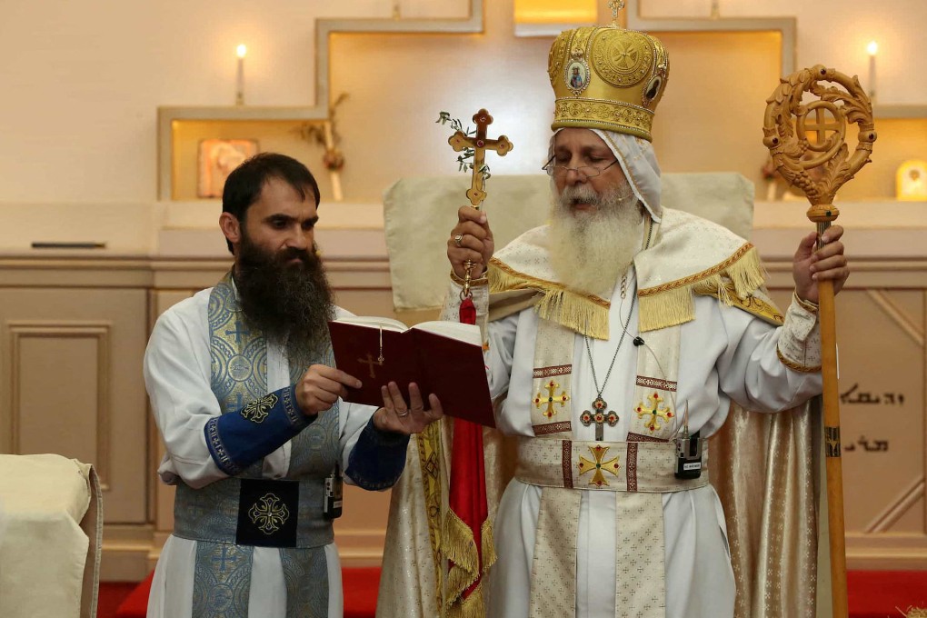 Senior parish priest Isaac Royel (left) and Bishop Mar Mari Emmanuel in Sydney. Emmanuel says he does not oppose to the stabbing video being shared on social media given “freedom of speech, and freedom of religion”. Photo: Reuters