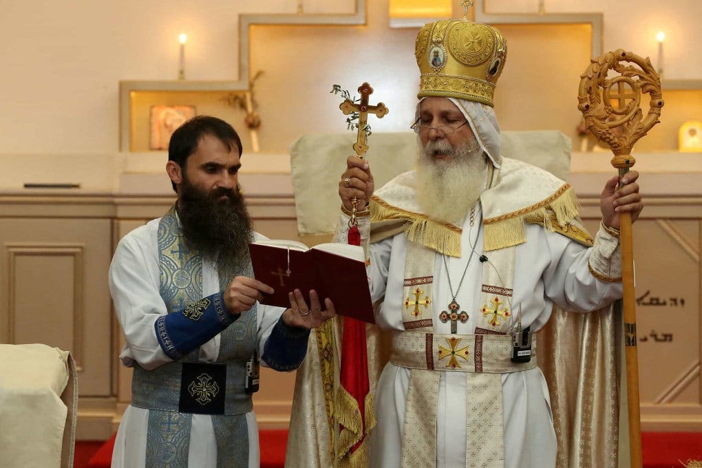 Senior parish priest Isaac Royel (left) and Bishop Mar Mari Emmanuel in Sydney. Emmanuel says he does not oppose to the stabbing video being shared on social media given “freedom of speech, and freedom of religion”. Photo: Reuters
