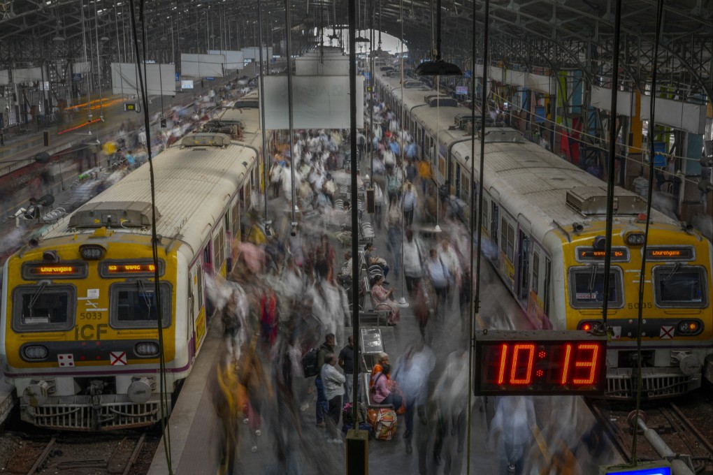Indian commuters get off trains at the Church Gate railway station in Mumbai, India. The country saw a record 411 million passengers in the first three weeks in April. Photo: AP