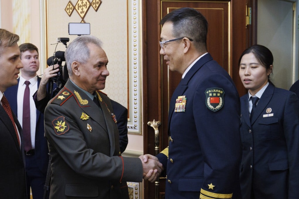 Russian Defense Minister Sergei Shoigu (left) greets Minister of National Defence of the People’s Republic of China Dong Jun on the sidelines of the Shanghai Cooperation Organisation in Astana, Kazakhstan, on Friday. Photo: Russian Defence Ministry Press Service via AP