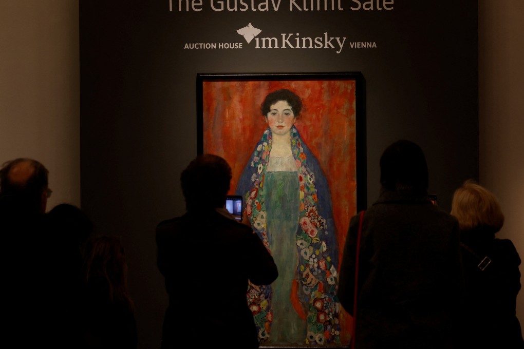 Visitors look at Austrian artist Gustav Klimt’s painting Portrait of Fraulein Lieser ahead of its sale on April 24 at auction in Vienna, Austria, to a Hong Kong buyer for US$32 million. A claimant to the work came forward just before its sale, it has emerged. Photo: Reuters