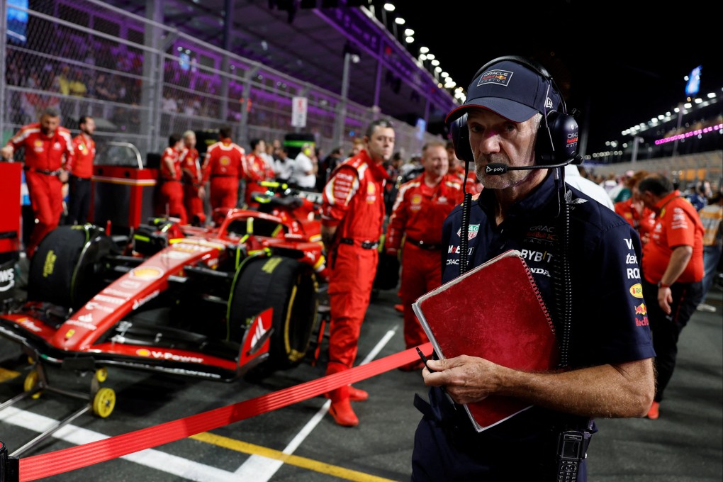Red Bull’s chief technology officer Adrian Newey with Ferrari engineers and Carlos Sainz Jr’s car before the Saudi Arabian Grand Prix. Photo: Reuters
