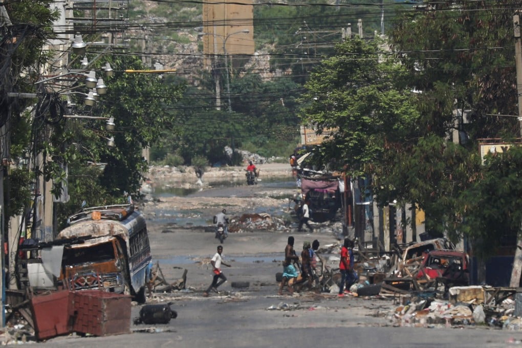 Armed gang members near the presidential palace in Port-au-Prince, Haiti, on Tuesday. Photo: Reuters