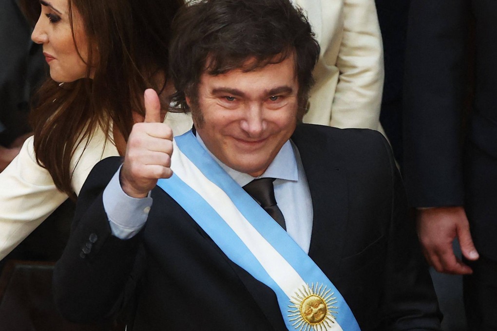 Argentina’s Javier Milei gives the thumb up after receiving the presidential sash and baton during his inauguration ceremony at the Congress in Buenos Aires in December 2023. Photo: AFP
