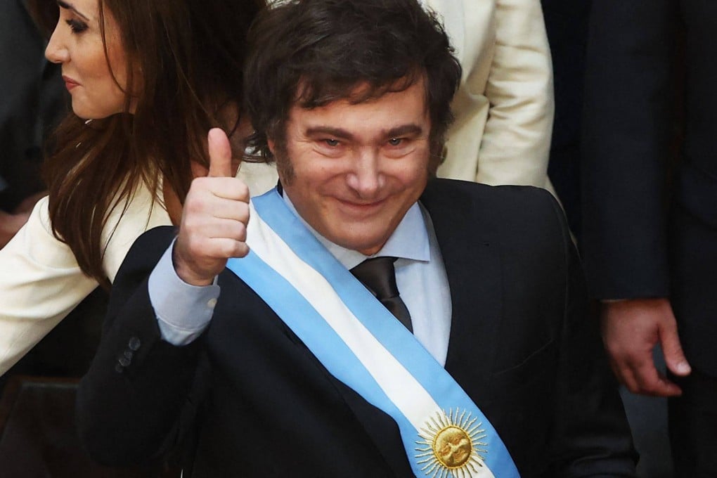 Argentina’s Javier Milei gives the thumb up after receiving the presidential sash and baton during his inauguration ceremony at the Congress in Buenos Aires in December 2023. Photo: AFP