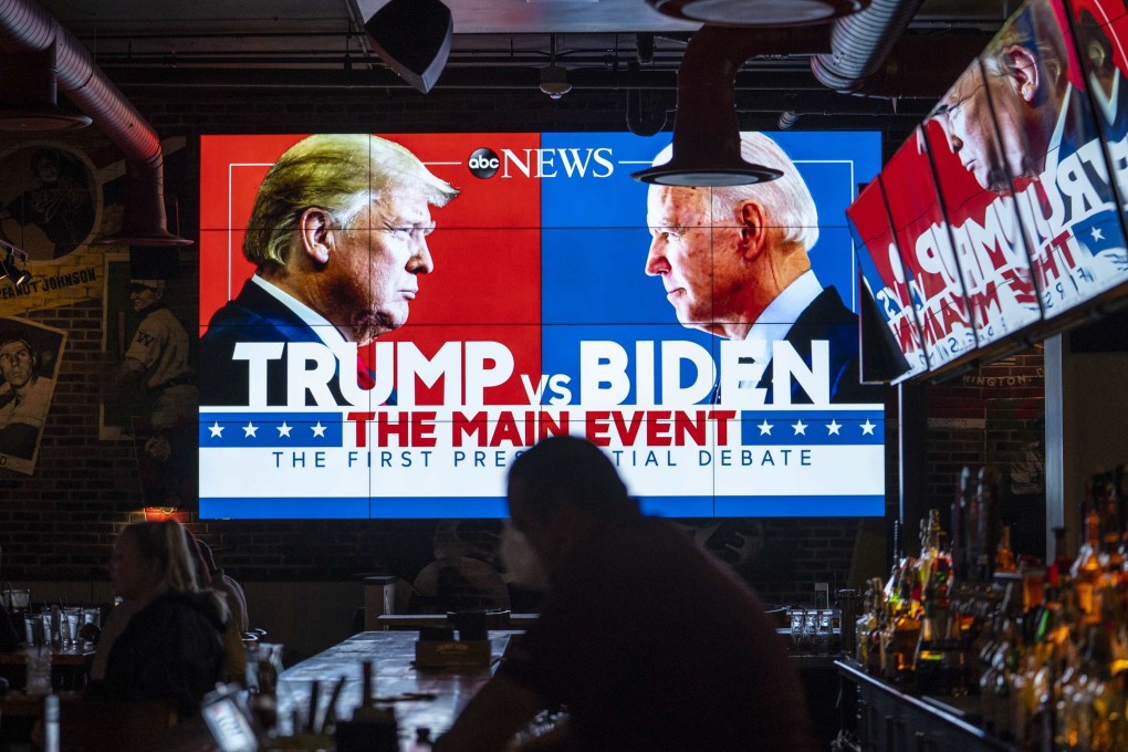 Television screens airing the first presidential debate are seen at a bar in Washington in September 2020. Photo: AFP