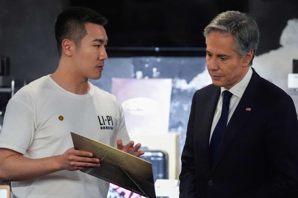 US Secretary of State Antony Blinken talks to Li-Pi record store’s Zhou Yuxuan during a visit Beijing on Friday. Photo: AFP