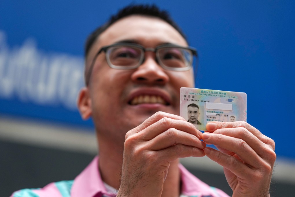 Henry Edward Tse with his new ID card. The transgender activist has vowed to keep up the fight for equality. Photo: Eugene Lee