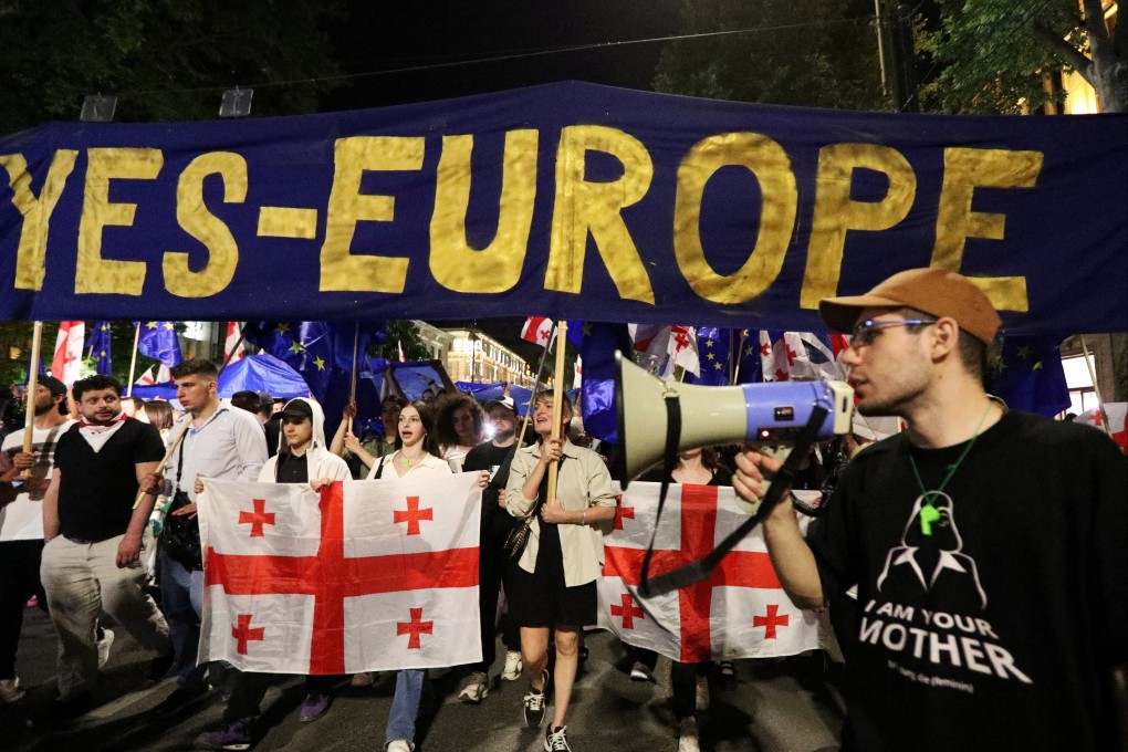 People protest in Tbilisi, Georgia on Sunday. Photo: Reuters
