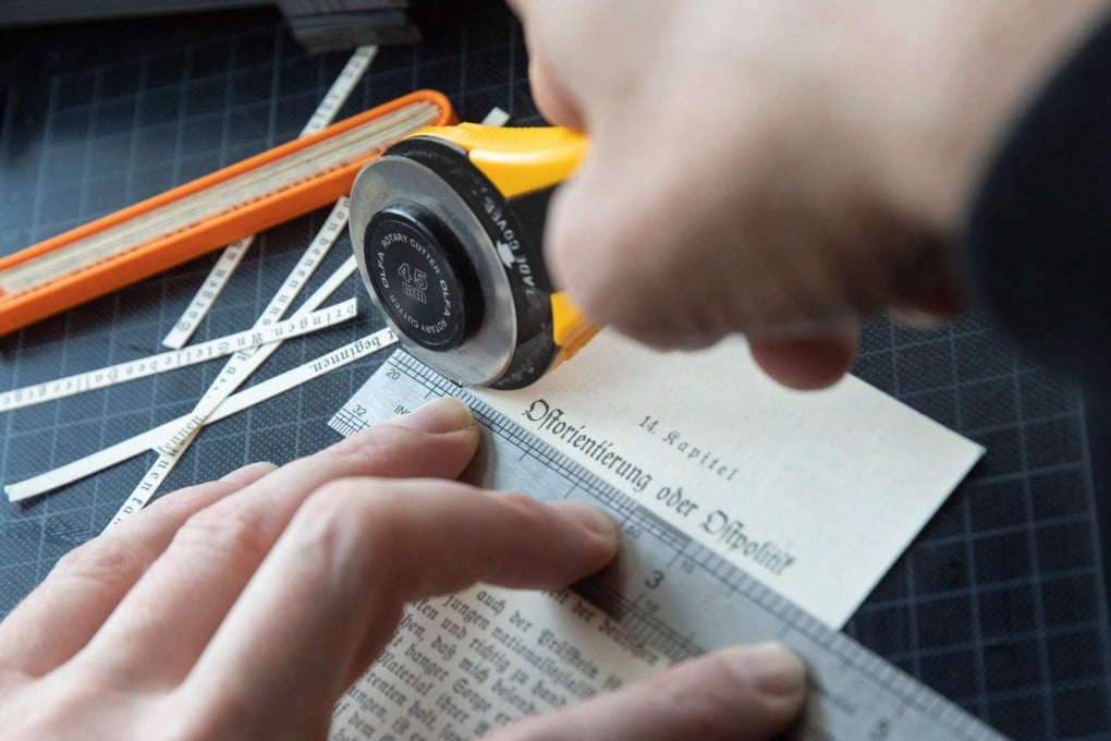 Austrian artist Andreas Joska-Sutanto has been cutting up Hitler’s book Mein Kampf letter by letter for the past eight years and recycling them to make a cookbook, with recipes for pizza, tiramisu and other dishes. Photo: AFP