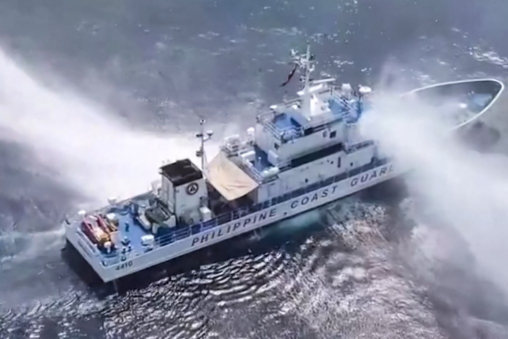 Philippine Coast Guard ship BRP Bagacay is hit by water cannons from Chinese vessels near Scarborough Shoal in the South China Sea on Tuesday. Photo: Philippine Coast Guard/AFP