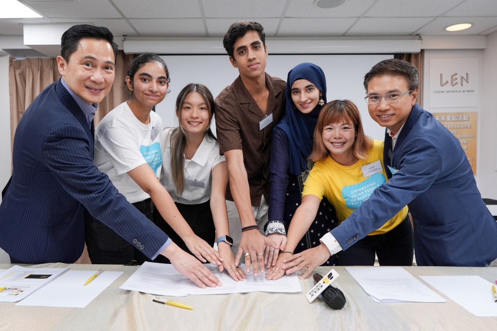 Wayne Fong from Prudential Hong Kong and KELY Support Group members, including Cindy Ng (second from right), pose with programme participants. Photo: Eugene Lee