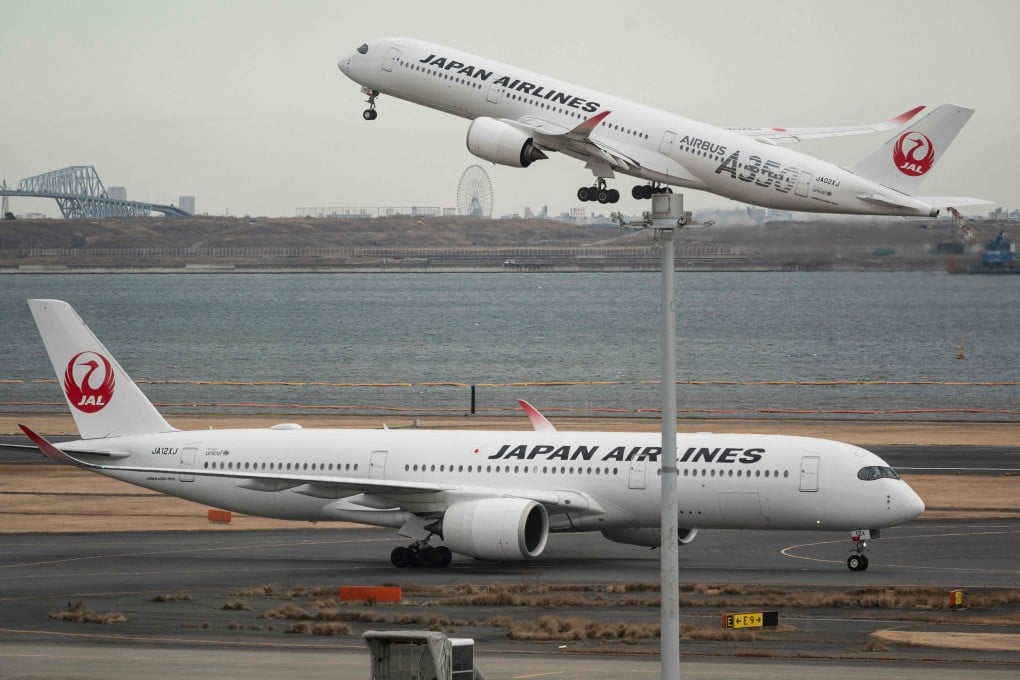 A Japan Airlines passenger jet takes off at Tokyo International Airport. Photo: AFP