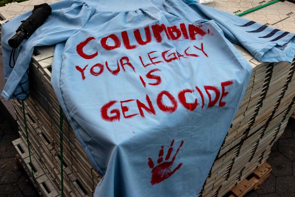 A graduation gown with a message from anti-Israel protestors is left outside the encampment at Columbia University on April 29, 2024. Photo: Getty Images via AFP