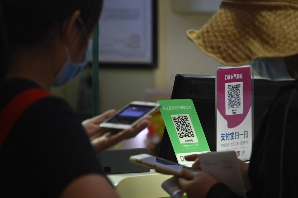 QR codes for WeChat Pay and Alipay at a food store in Beijing. Despite the mobile payment app providers making it easier for foreign bank cards to be used with them, overseas visitors continue to report difficulties making payments in China. Photo: AFP