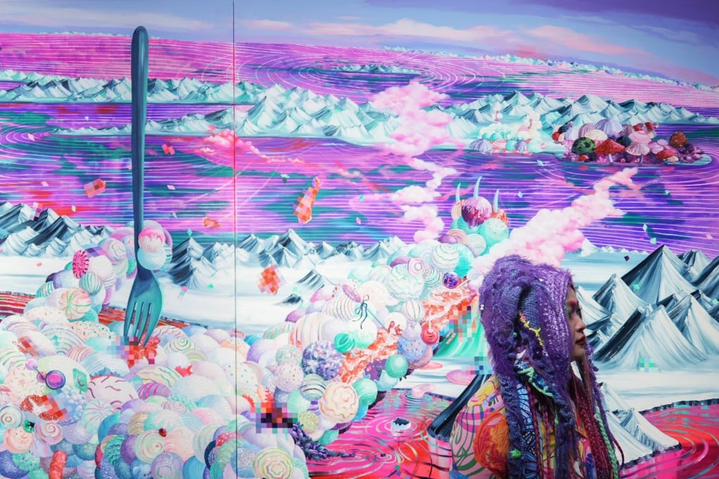 A visitor poses for photos with the artwork “Lollipop Bear” by Eguchi Ayane at Art Basel at the Hong Kong Convention and Exhibition Centre in Wan Chai on March 27, 2024. Photo: Eugene Lee