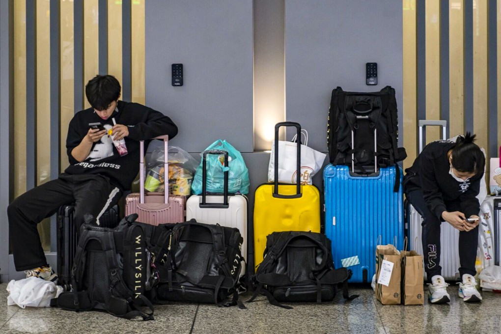 On April 30, travellers wait at Hongqiao High-speed Railway Station ahead of May Day holidays in Shanghai. Some universities in China are accused of imposing unnecessary rules on adult students travelling in the break. Photo: Bloomberg