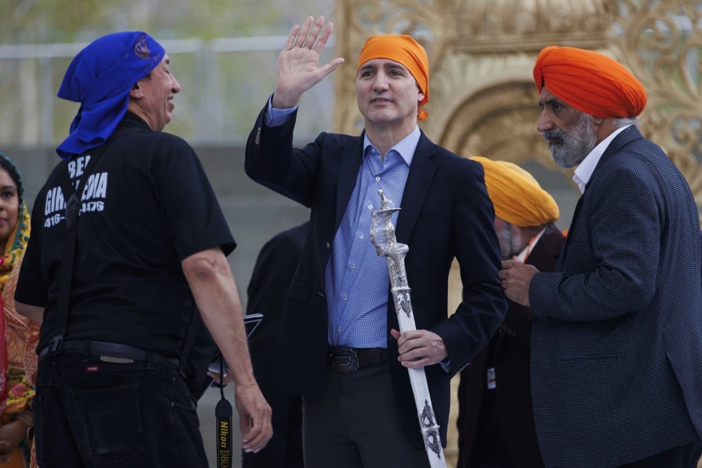 Canadian Prime Minister Justin Trudeau (centre) waves to the crowd after receiving a ceremonial sword as a gift from the Ontario Sikhs and Gurudwara Council on April 28. Photo: The Canadian Press via AP