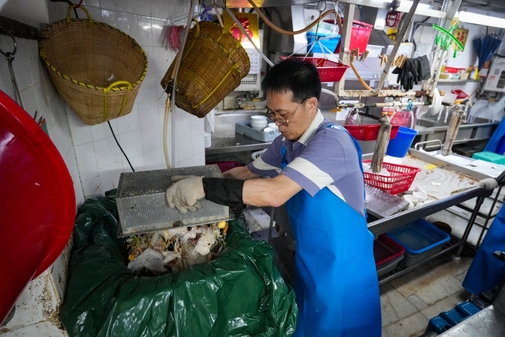A worker at a restaurant taking part in a trial run of the waste-charging scheme. Authorities are expected to brief legislators on the results later this month. Photo: Sam Tsang