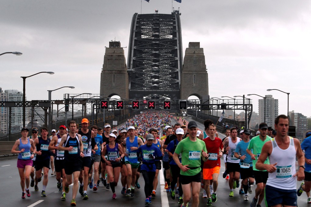 Competitors run across the Sydney Harbour Bridge during the Sydney marathon. Photo: Reuters