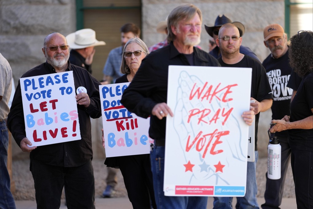 Anti-abortion protesters stand outside Arizona’s state Capitol in Phoenix on Wednesday. Photo: AP