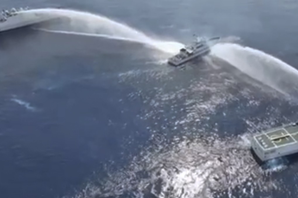 A Philippine coastguard vessel is hit by water cannons from Chinese ships near Scarborough Shoal in the disputed South China Sea on April 30. Photo: PCG via AP