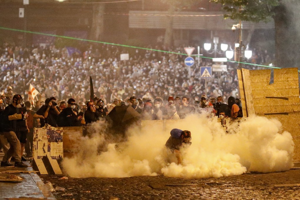 Protestors clash with riot police in Tbilisi, Georgia, on Wednesday. Photo: EPA-EFE