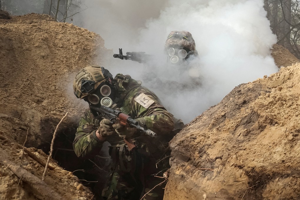 Ukrainian servicemen take part in radiation, chemical and biological hazard drills Kharkiv in February. Photo: Reuters