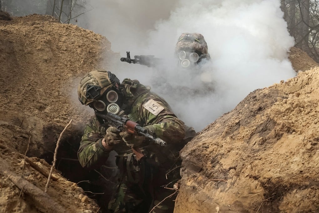 Ukrainian servicemen take part in radiation, chemical and biological hazard drills Kharkiv in February. Photo: Reuters