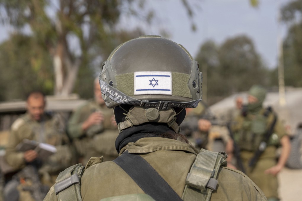 Israeli soldiers gather near the Israeli-Gaza border in southern Israel before they enter the Gaza Strip. Photo: AP
