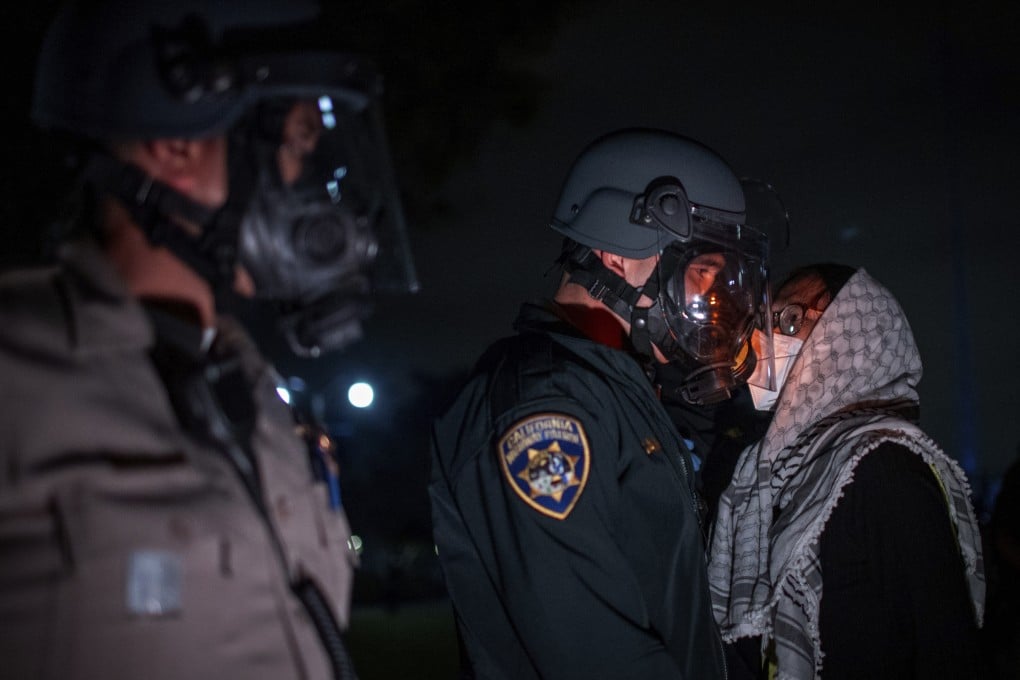 A pro-Palestinian protester confronts police at UCLA in Los Angeles on Wednesday. Photo: AP
