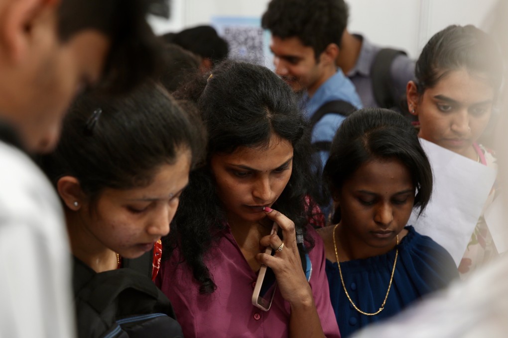 Job seekers gather at a mega job fair on February 27, organised by the Karnataka state government in Bengaluru, India, where 600 companies are looking to hire at least 50,000 people. Photo: EPA-EFE