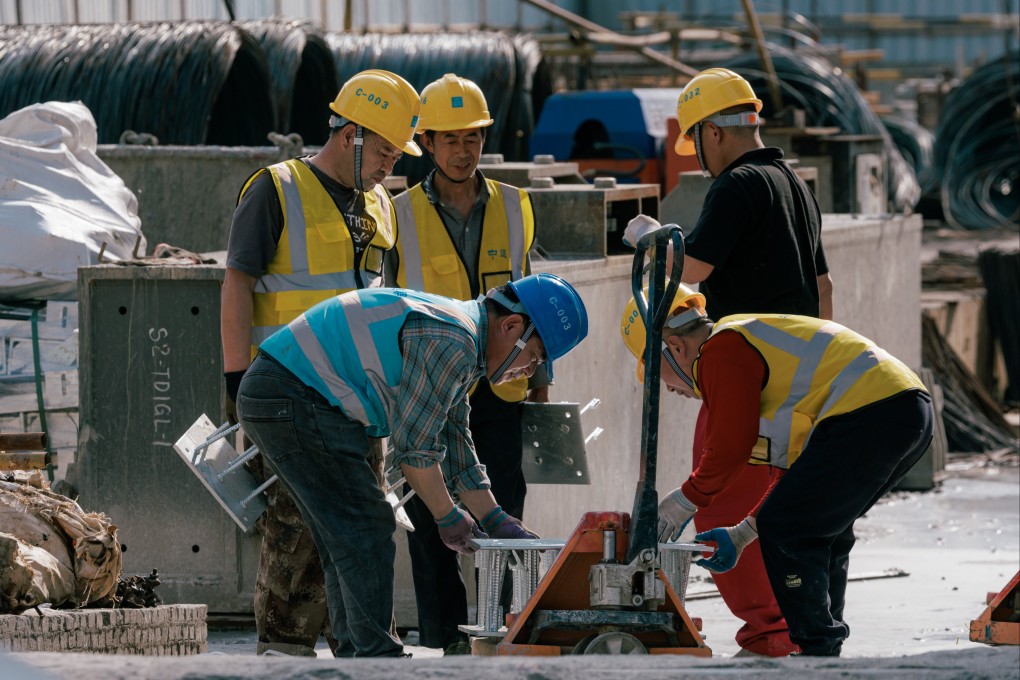 The number of construction jobs for migrant workers fell last year amid the property sector crisis.  Photo: EPA-EFE