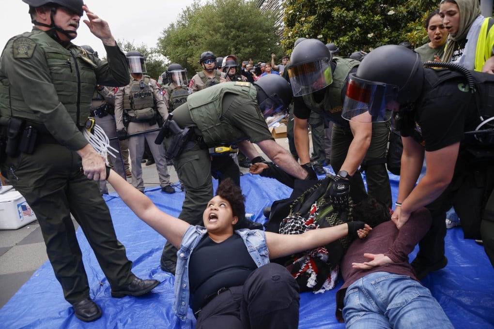 Protesters are taken into custody as law enforcement dismantle an encampment by pro-Palestinian students at the University of Texas on May 1, 2024, in Richardson, Texas. Photo: AP