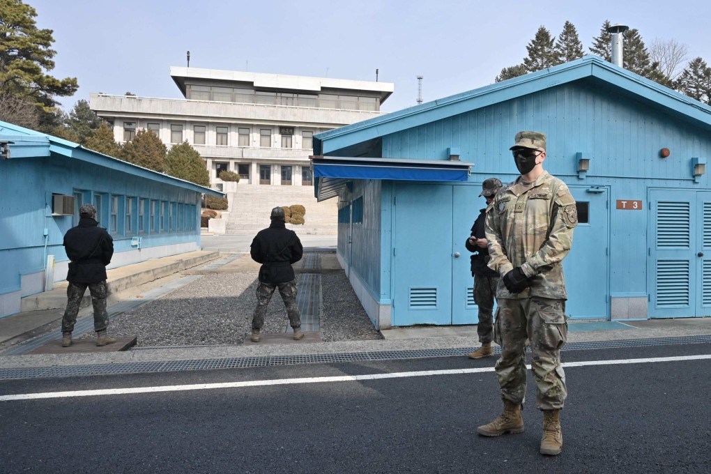 A US soldier and South Korean soldiers stand guard in the Joint Security Area of the Demilitarised Zone separating North and South Korea. Photo: AFP