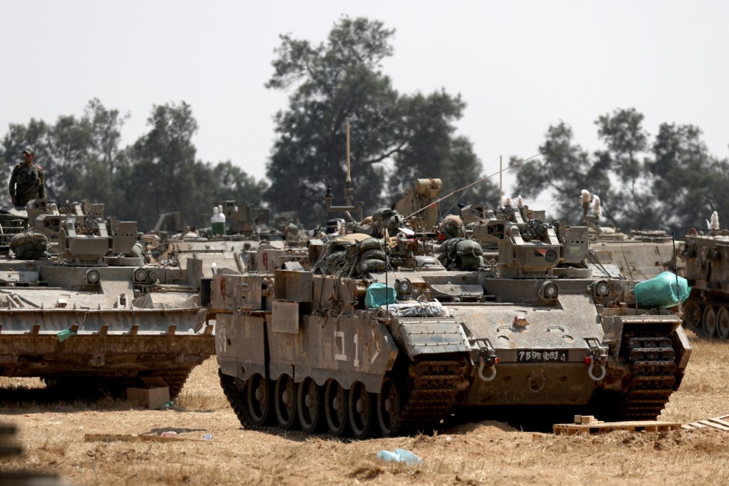 Israeli soldiers gather in military vehicles on the southern Israeli border with the Gaza Strip, near the Palestinian city of Rafah, on Wednesday. Photo: EPA-EFE