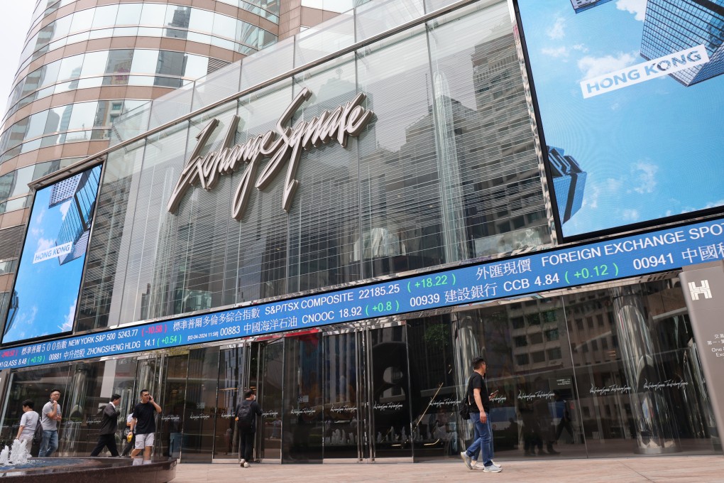 People walk by Hong Kong’s Exchange Square, home of the Hong Kong stock exchange, on April 2, 2024. Photo: Jelly Tse.