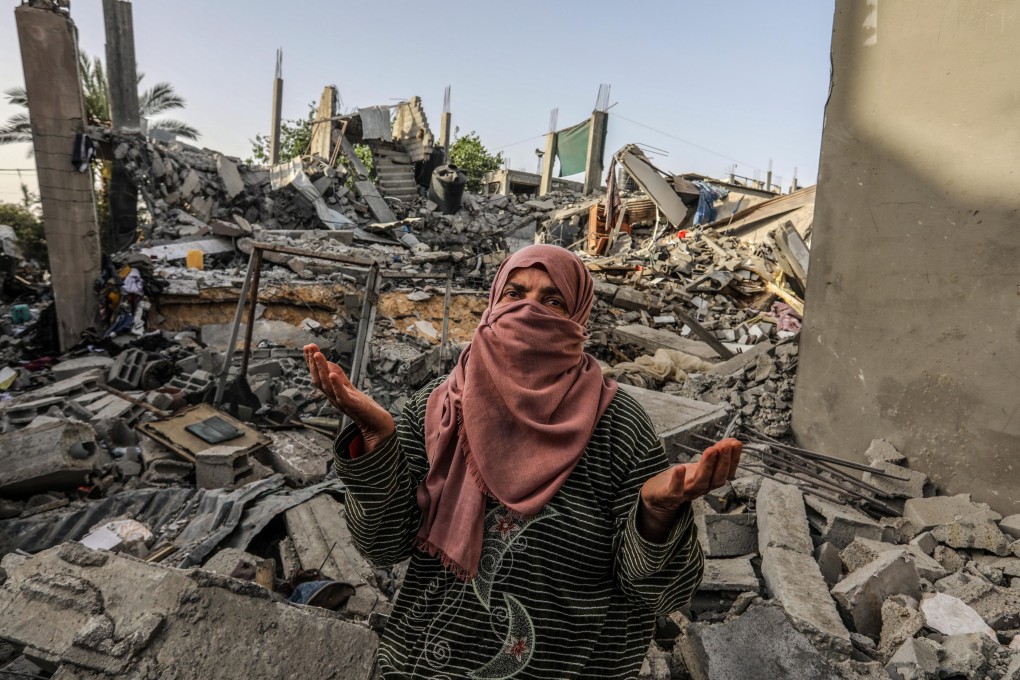A Palestinian woman inspects a house that was destroyed in Israeli bombing, in the southern Gaza Strip last week. Photo: dpa