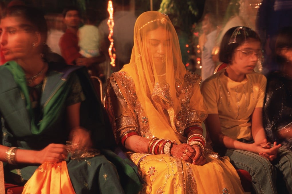 A bride sits during her marriage ceremony in India. Photo: Getty Images